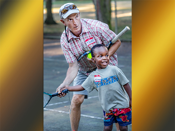 (TnT/TLC) Try and Think/Tender Loving Care Coordinator, Stewart Bartlett teaches tennis and compassion